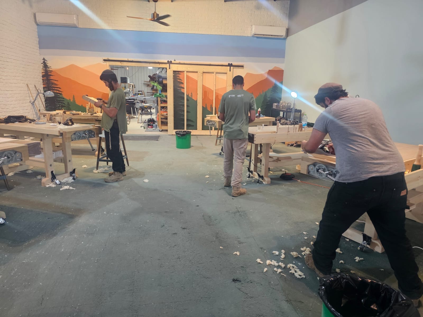 Men working in the indoor wood workshop