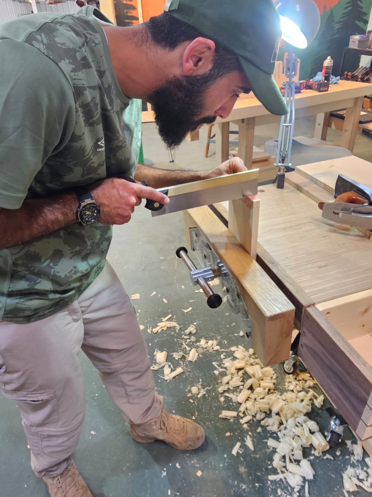 Soldier working with wood at therapeutic retreat